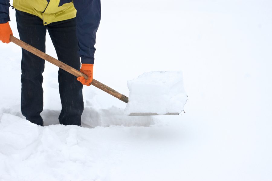 Man digging a path from the snow
